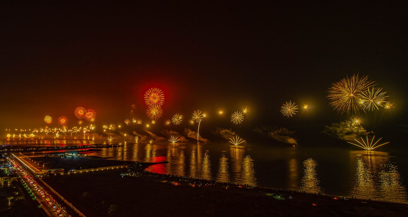 Fireworks and drones closing the night above the water