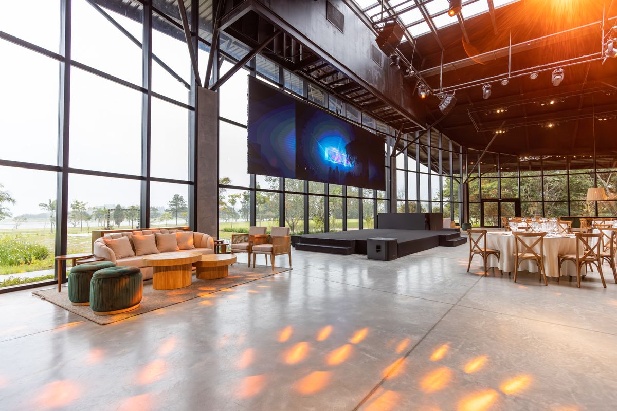 The event hall with projection screen and sound rig
