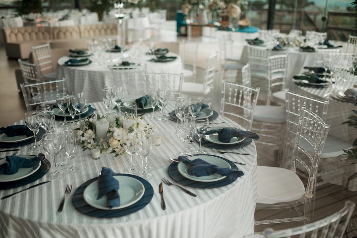 A reception tablescape set in ivory and gold