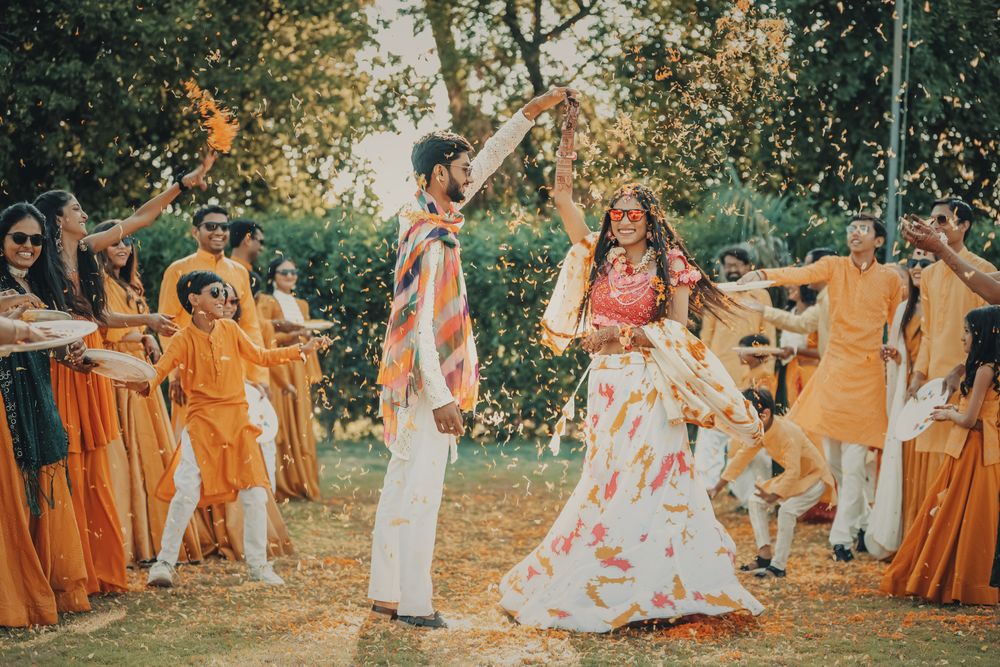 Guests showering the couple with flower petals